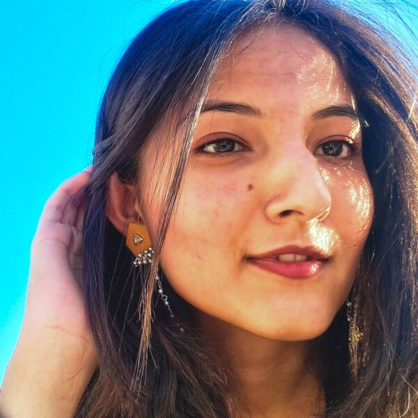 customer wearing patang earrings