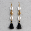 Handmade 18 K Gold plated and white cowrie shell long earrings with black tassels on a brass wire.