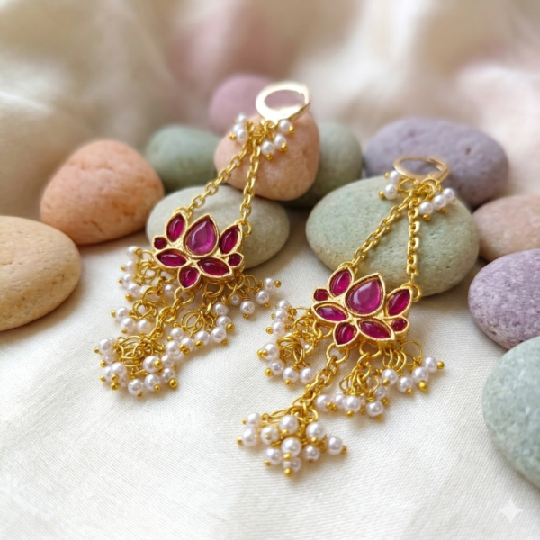Royal purple Kundan statement chandelier earrings with anti-tarnish brass base and intricate pearl tassels for festive celebrations.
